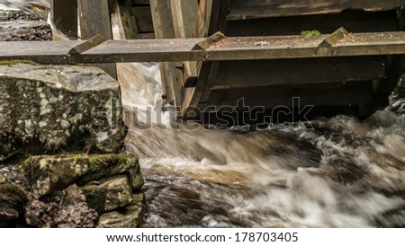 Water from a watermill near an old iron mine is colored due to the iron oxide content