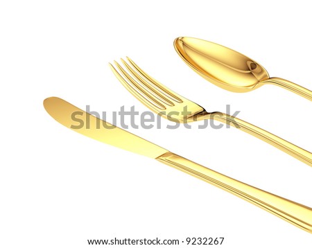 gold knife, fork, spoon isolated close up view