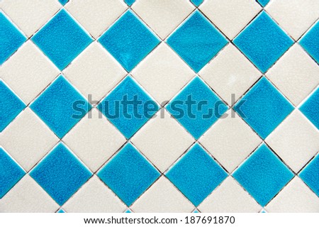 Blue and white of diamonds pattern tile wall.