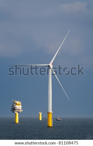 Offshore wind turbine and a transformer substation in a windfarm under construction of the Norfolk Coast, North Sea