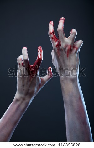 Creepy zombie hands, extreme body-art, studio shot