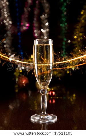 New Year card with champagne glass with sparkles