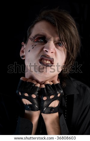 Muestrario Stock-photo-expressive-gothic-boy-with-artistic-make-up-and-blue-lenses-isolated-on-black-background-36808603