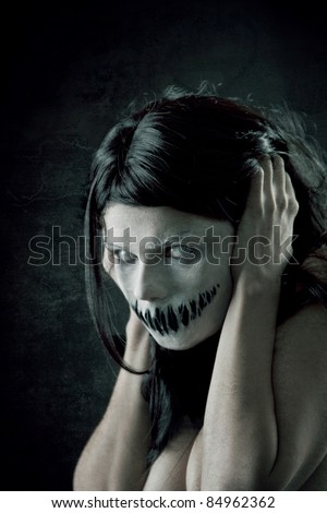 Horrible girl with scary mouth and eyes, extreme body-art