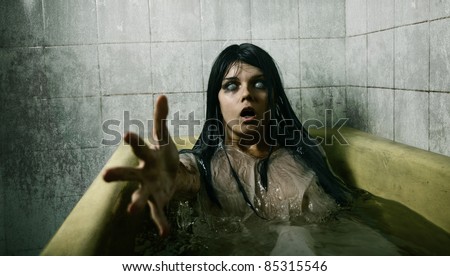 Scary Girl In Bath Stretching Her Hand To Camera, Halloween Theme Stock ...