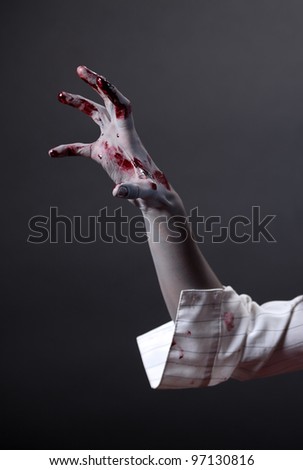 Creepy zombie hand, extreme body-art, studio shot