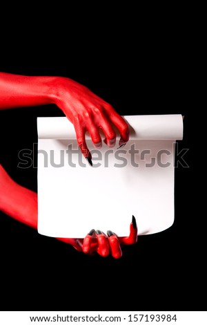 Red devil hands holding paper scroll, deal with devil concept