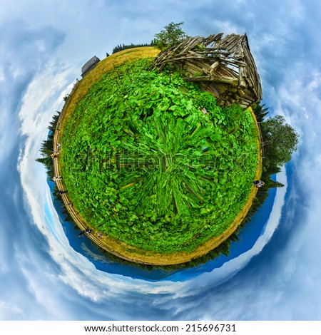 Green mountains field with old wooden house ruins and small people planet panorama
