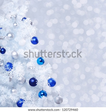 Verical closeup photo of white decorated christmas tree
