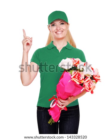floral delivery girl in green   uniform  holding the bouquet showing pointing finger