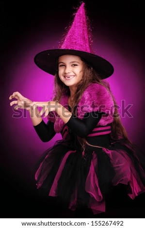 scaring halloween witch on dark background side view