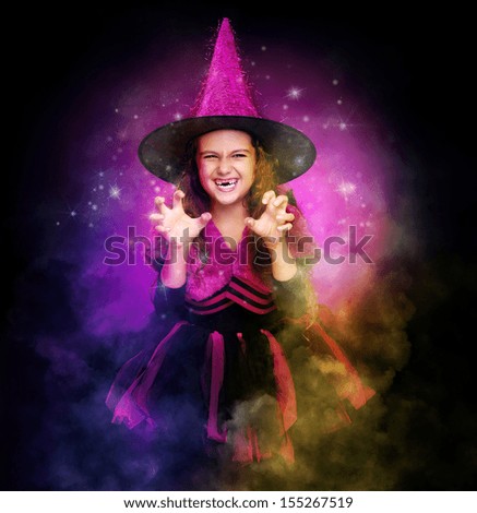 scaring halloween witch on dark smoke background