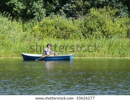 The lake. Fishing men on the boat
