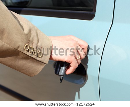 men hand in jacket open car door
