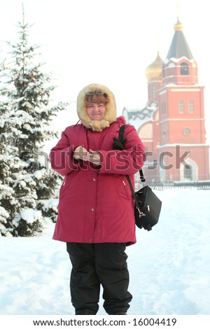 pretty russian plump woman photophrapher in frost winter