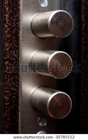 metal door lock with pull out bolts close-up