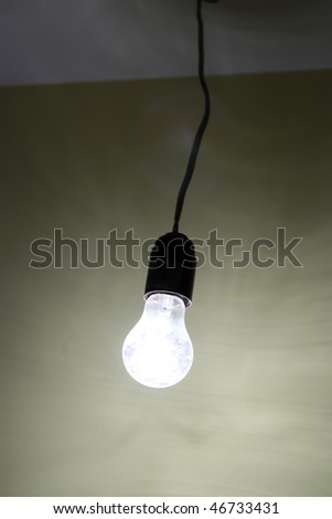lighting dirty electrical lamp hanging on cable