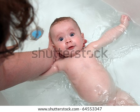 stock photo happy baby girl bath by mother in bathtub