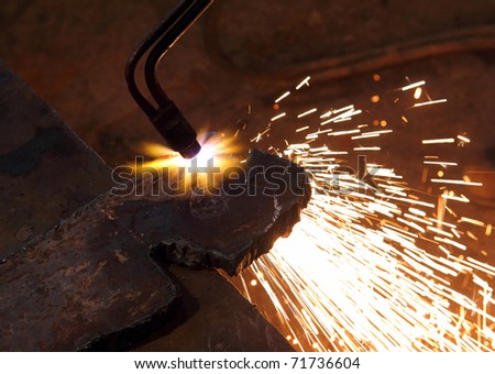 metall detail cutting with acetylene welding close-up