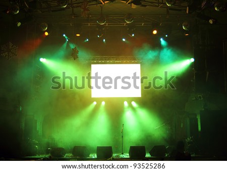 empty stage and screen in the rays of light concert
