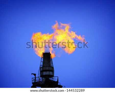 torch is lit on tower refinery - air pollution