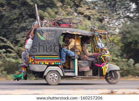 AGRA, INDIA - NOVEMBER 16, 2012: Auto rickshaw on indian road in Agra, India, 16 nov 2012