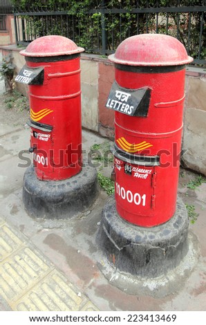 DELHI, INDIA - November 30, 2012: Two red postboxes outside the India post office