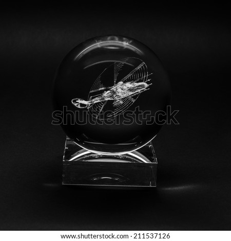 A helicopter. Laser engraving inside the glass.
