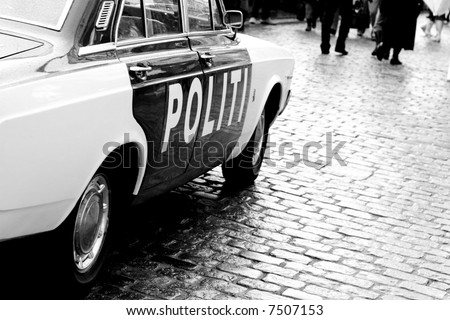 Old police car. Black and white photo
