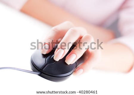 Female hand on computer mouse. Selective focus. White background