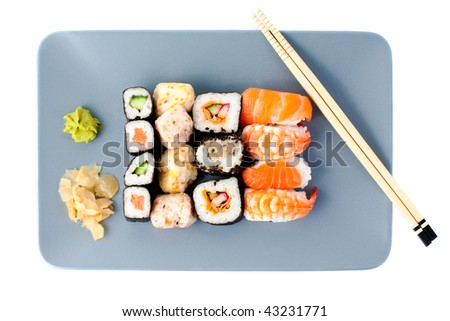 Set of sushi on rectangular blue plate - japanese food. With chop sticks