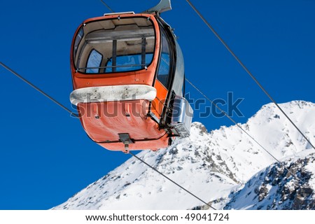Empty old style gondola lift on ski resort
