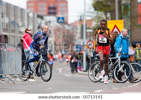 ROTTERDAM, THE NETHERLANDS - APRIL 11 : Annual Fortis Rotterdam Marathon. Runners on the city streets on April 11, 2010 in Rotterdam