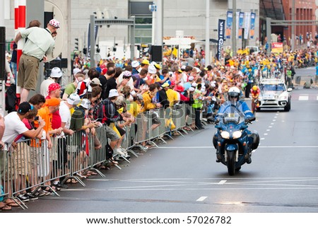 ROTTERDAM, THE NETHERLANDS - JULY 3 : Tour de France - annual bicycle race. Cyclist during the first day of competition - prologue race on the city streets on July 3, 2010 in Rotterdam