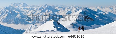 Wide panorama of ski pistes. Alpine skiing on glacier