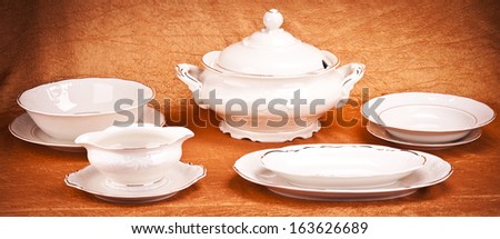 Dinnerware set on orange background