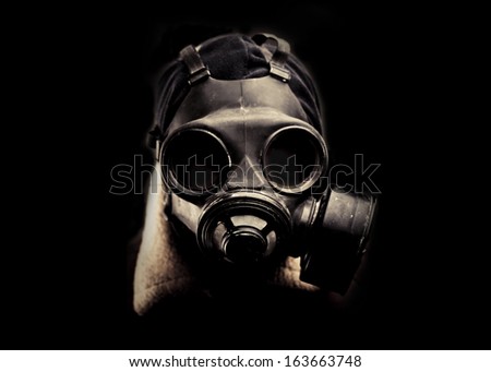 Portrait man in gas mask.