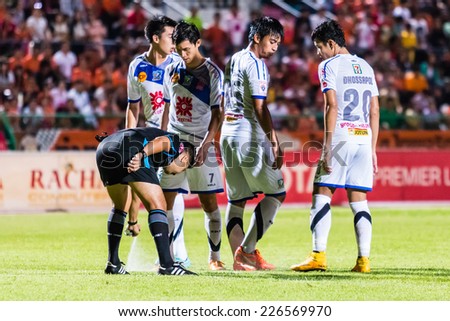 SISAKET THAILAND-OCTOBER 22: The referee use the vanishing spray during Thai Premier League between Sisaket FC and Air Force Central FC at Sri Nakhon Lamduan Stadium on October 22,2014,Thailand