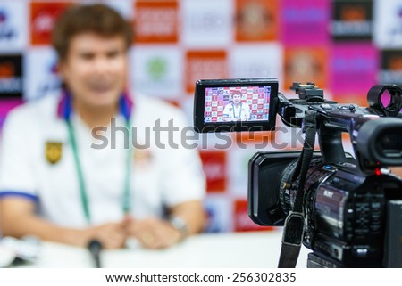 SISAKET THAILAND-FEBRUARY 18: Professional camcorder recording at a press conference after the match between Sisaket FC and BEC Tero at Sri Nakhon Lamduan Stadium on February 18,2015,Thailand