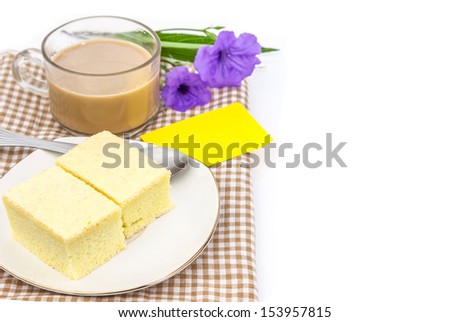 Cup of coffee and bakery on cloth against white background