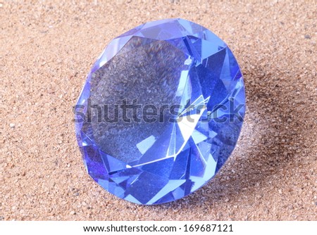 blue diamond on  sand background