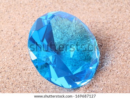 blue diamond on  sand background