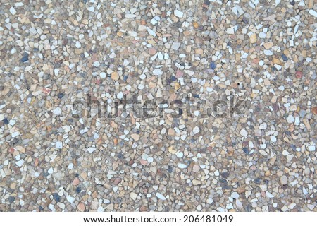 rough texture surface of exposed aggregate finish, Ground stone washed floor, made of small sand stone in light brown color