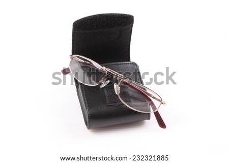 Eyeglasses on black leather eyeglasses case isolated on white
