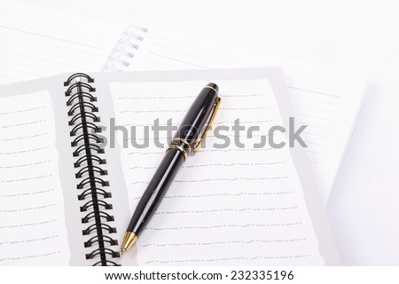Blank open notebook with black pen isolated on white