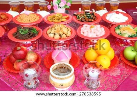 Food plates near the Chinese temple in Singapore, prepared for the believers