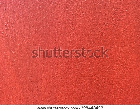 Texture concrete painted with red paint
