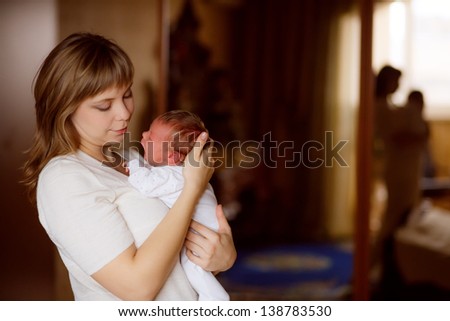 happy mother breast feeding her baby infant