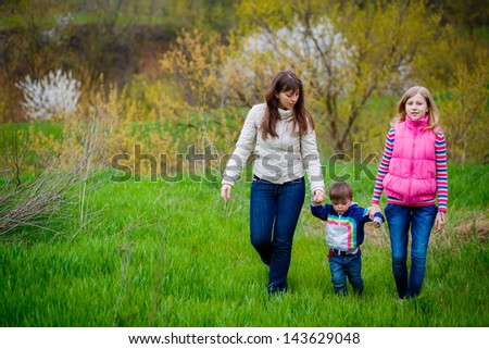 Family walk in the spring garden