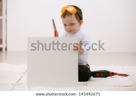 beautiful smiling boy instruments repairs shelf